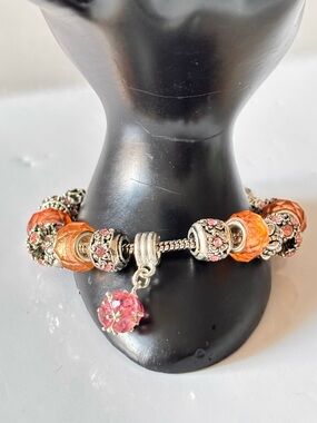 Pandora-style charm bracelet peaches glass beads and sliver pink rhinestones.